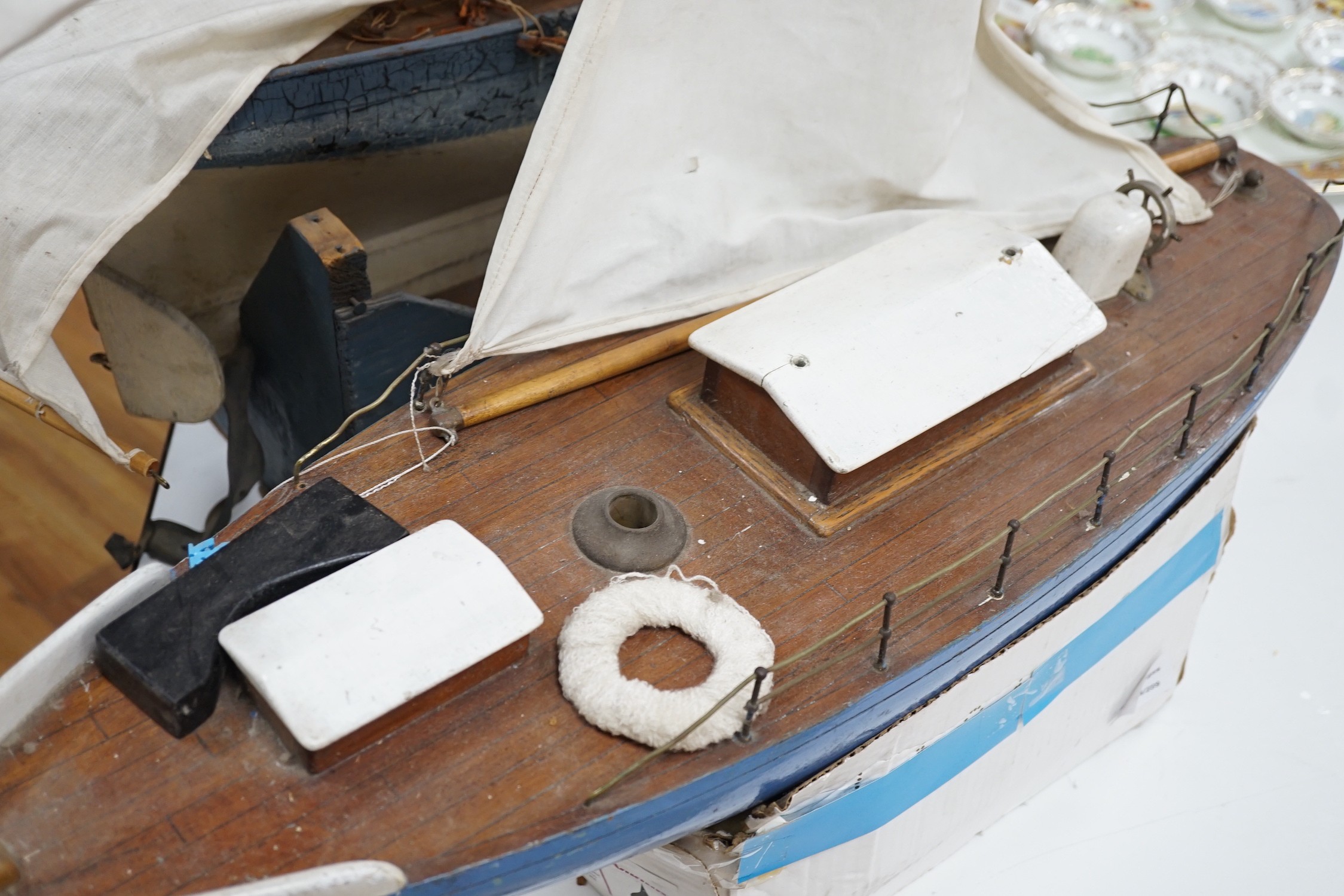 Two large over-painted pond yachts, largest 91cms
